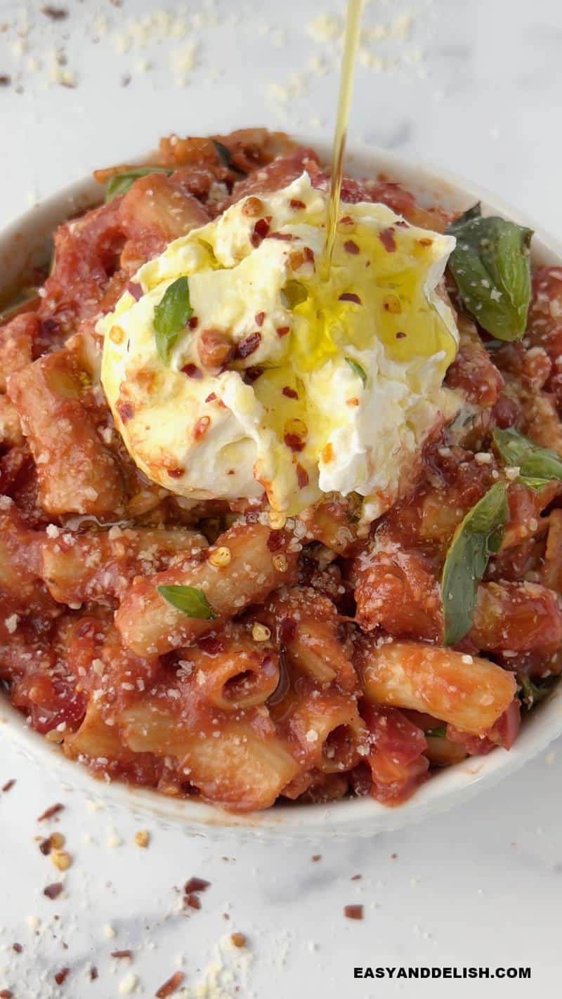 olive oil drizzled over penne pomodoro