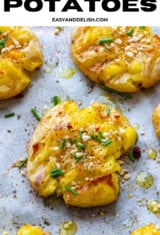 several crispy smashed potatoes in a baking sheet