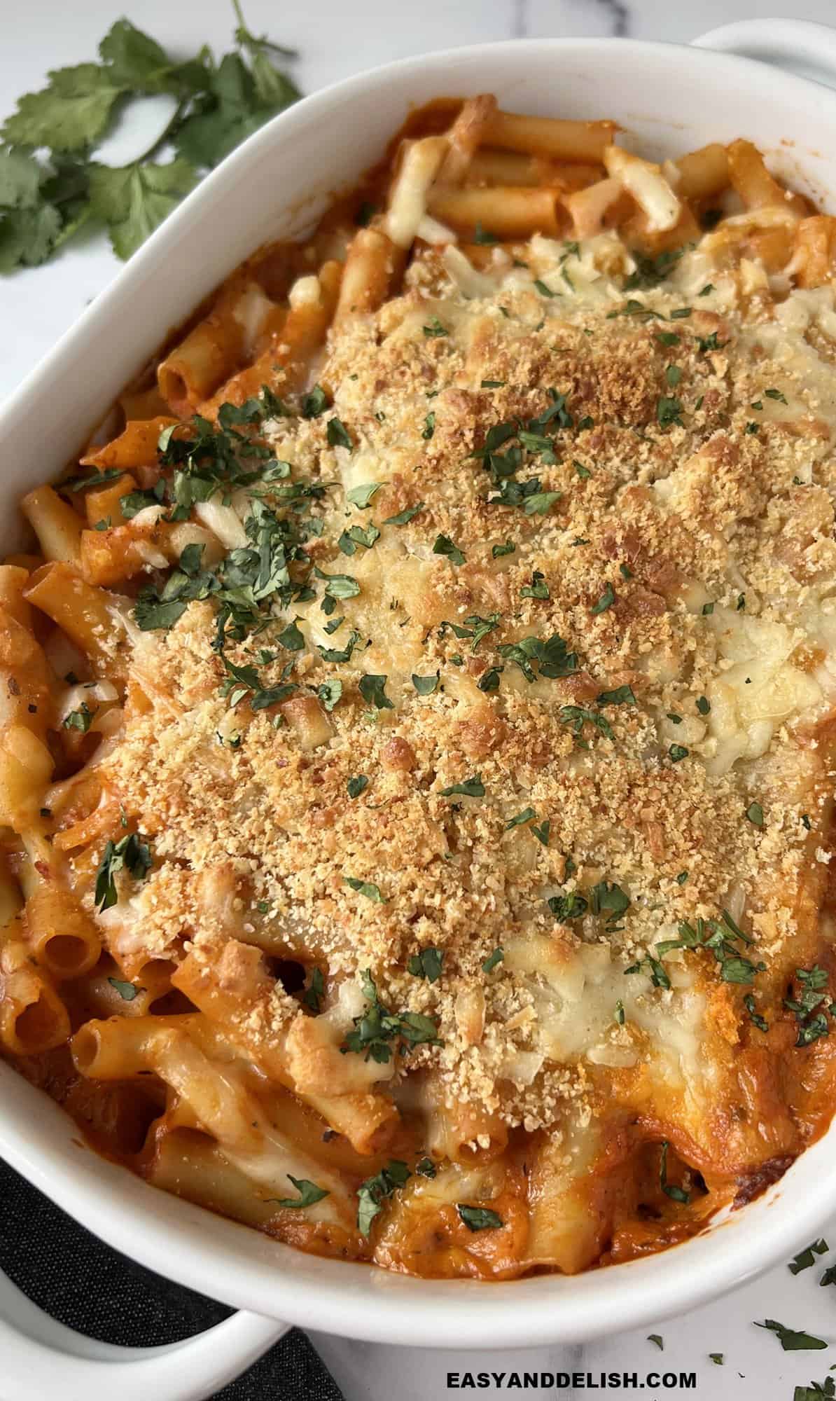 Olive Garden Baked Ziti ready to serve in a baking dish