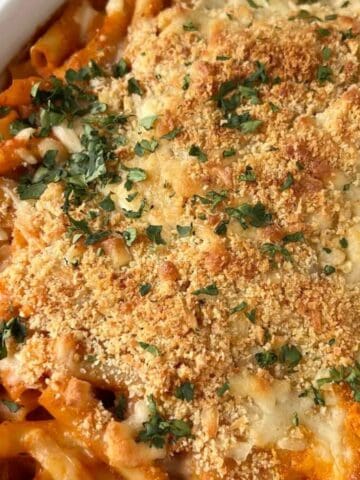 Creamy tomato ziti topped with browned panko, melted cheese, and fresh parsley.