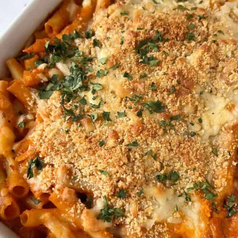 Creamy tomato ziti topped with browned panko, melted cheese, and fresh parsley.