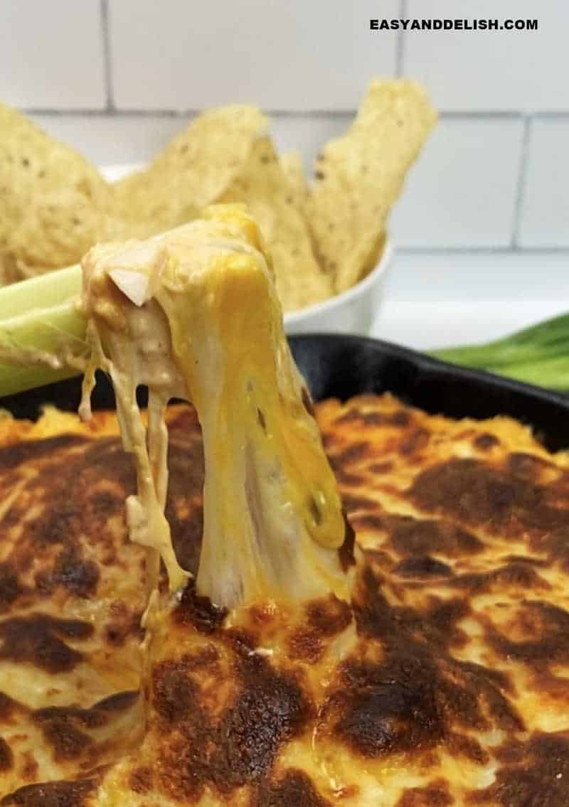 close up of melted cheeses pulled up with a keto tortilla chip