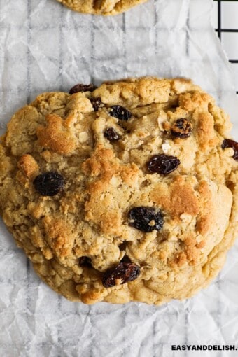 close up of an easy oatmeal raisin cookie on a wire rack