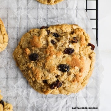 close up of an easy oatmeal raisin cookie on a wire rack