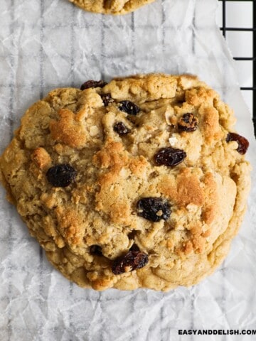 close up of an easy oatmeal raisin cookie on a wire rack