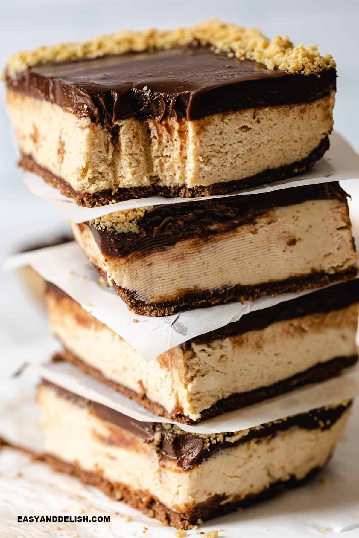 close up of a stack of keto no-bake chocolate cheesecake bars