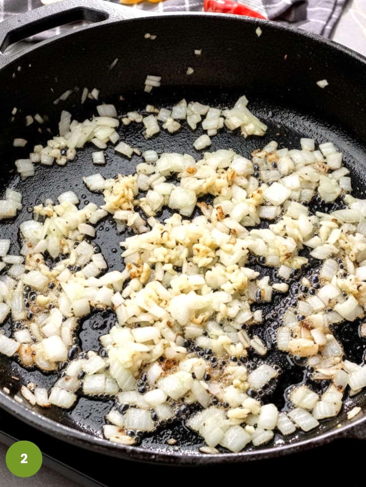 Add onions and cook with garlic.