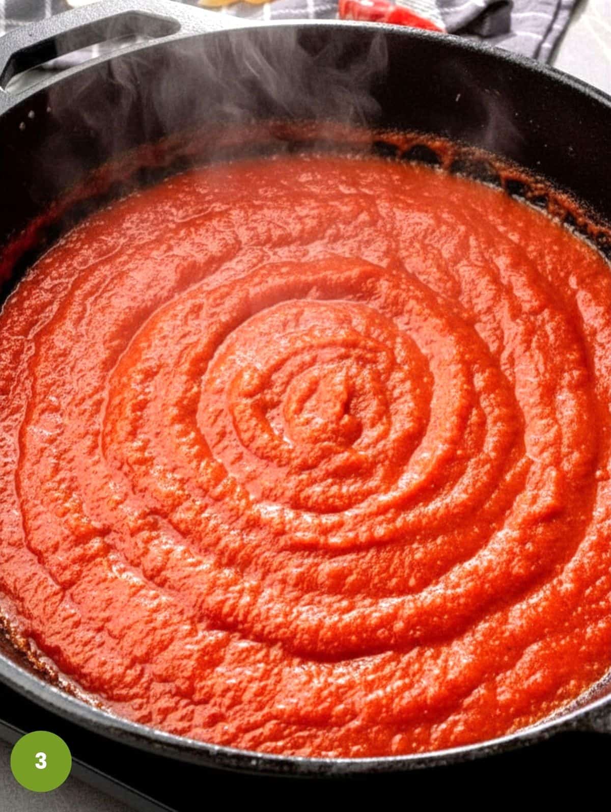 Add tomatoes and break them down.