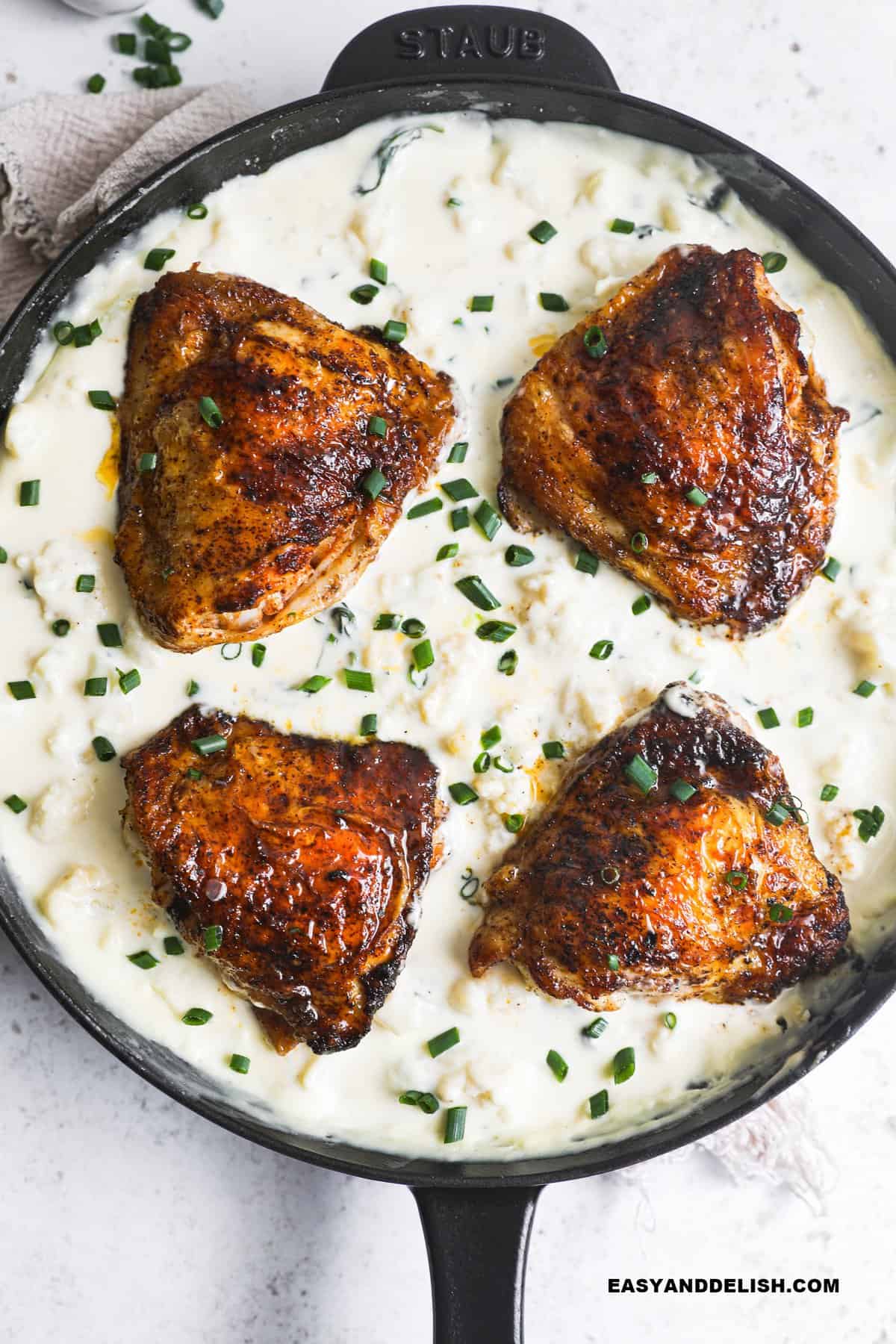 A plate of past with chicken thighs