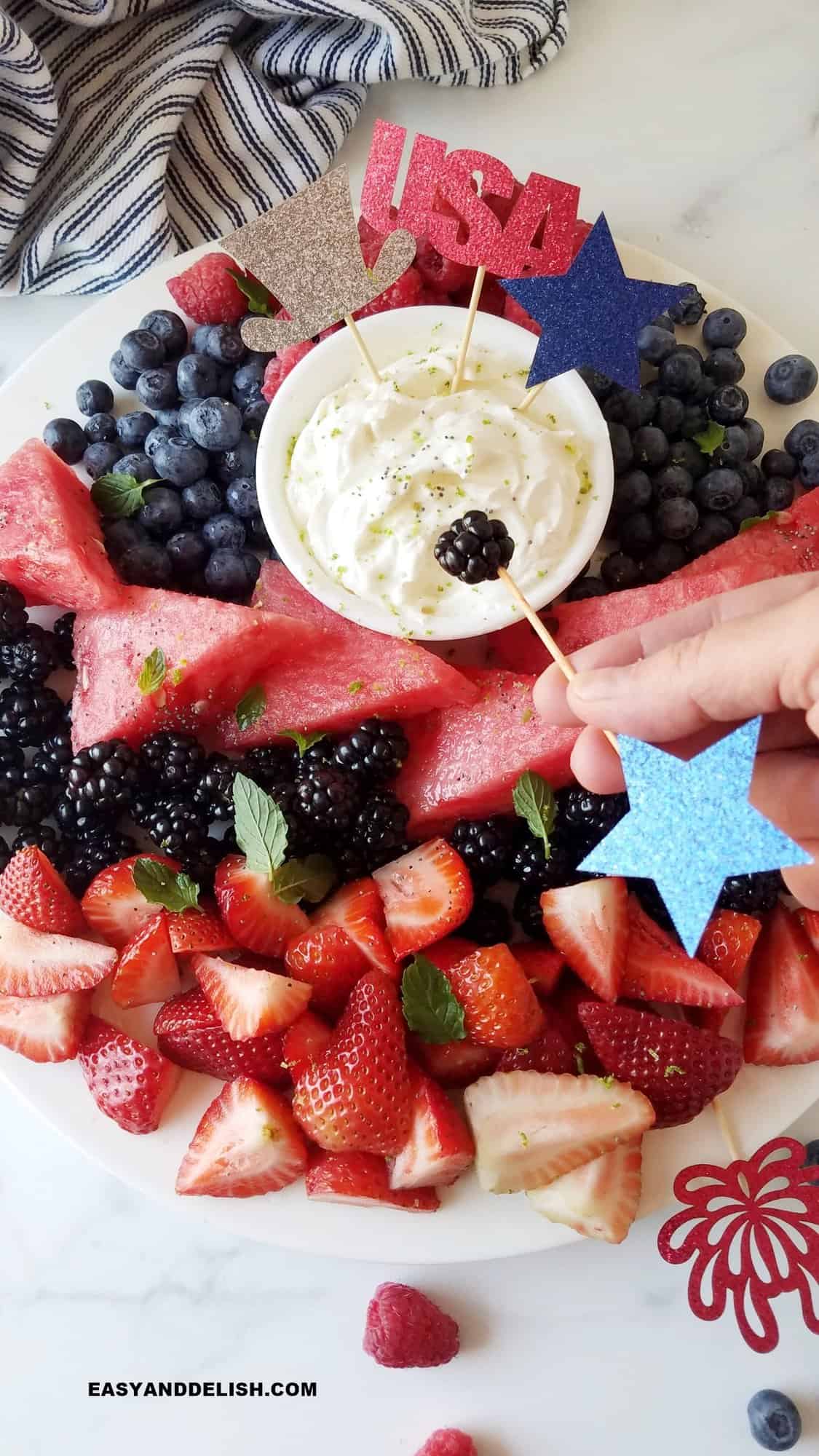 a blueberry dipped in keto cream cheese fruit dip