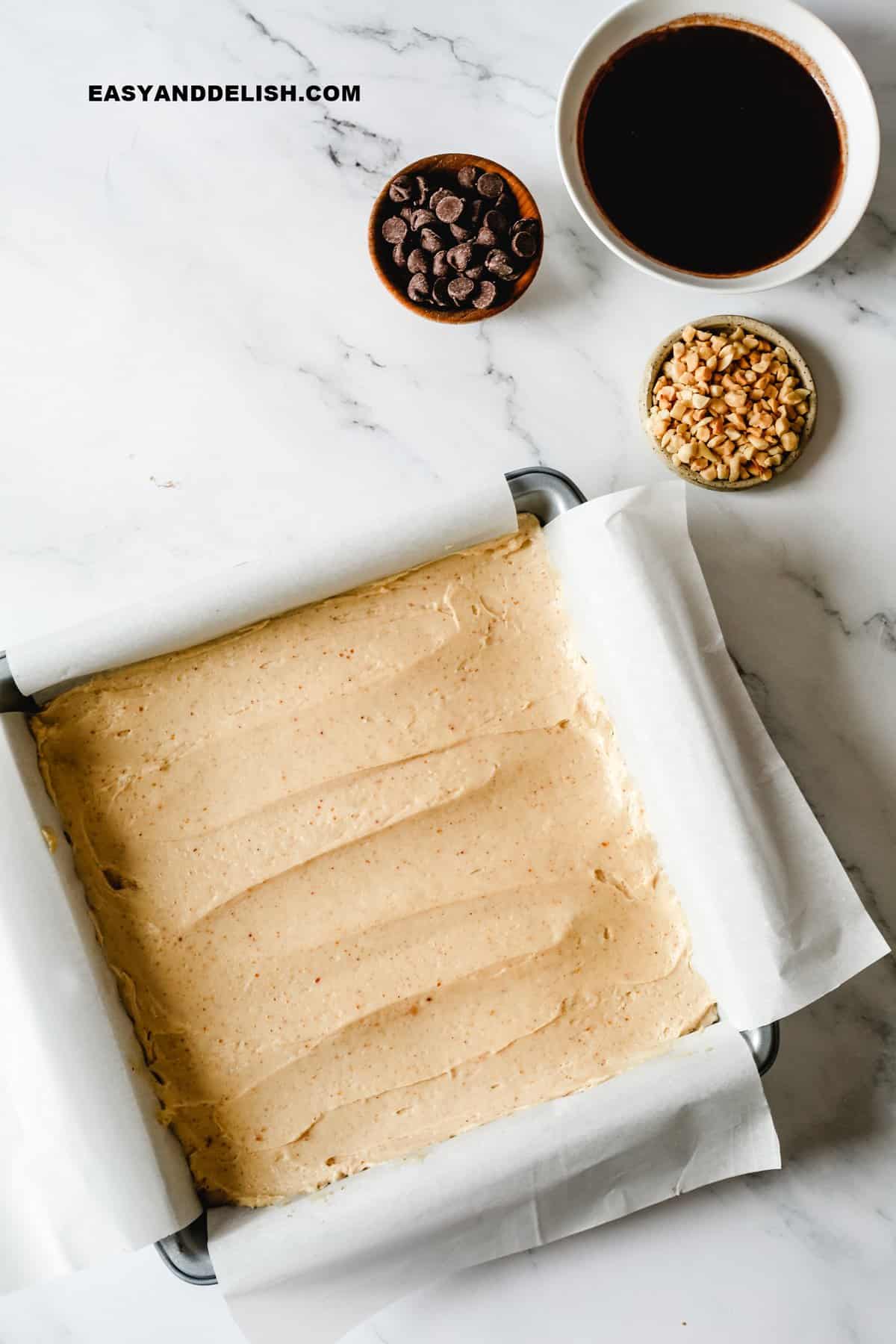 a pan with a smooth cheesecake filling into it