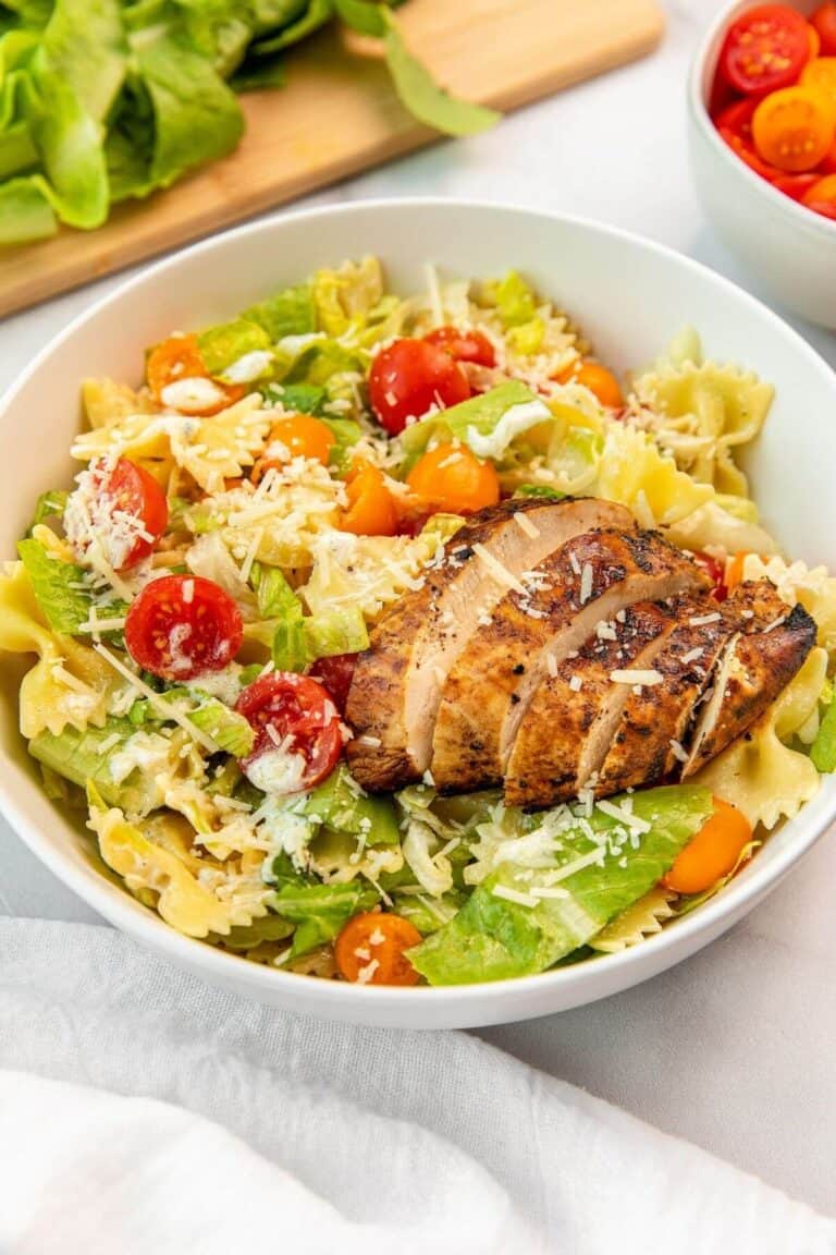 a bowl of balsamic chicken caesar pasta salad