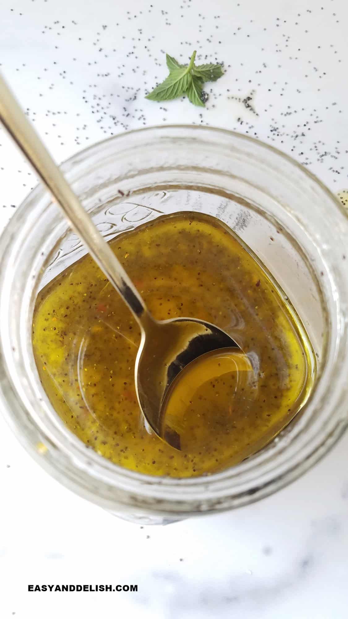 poppyseed dressing in a jar being mixtured 