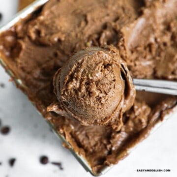 a scoop of high protein ice cream scooped out of a metal container
