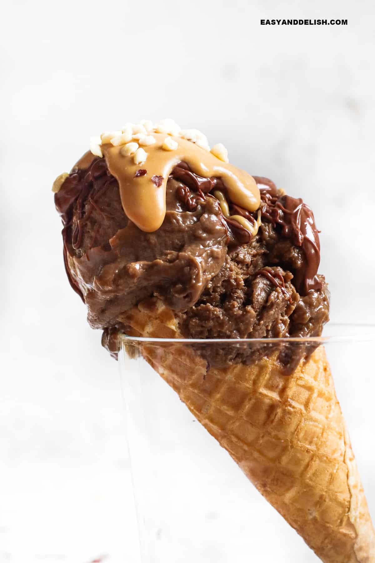 a cone of high protein ice cream with toppings