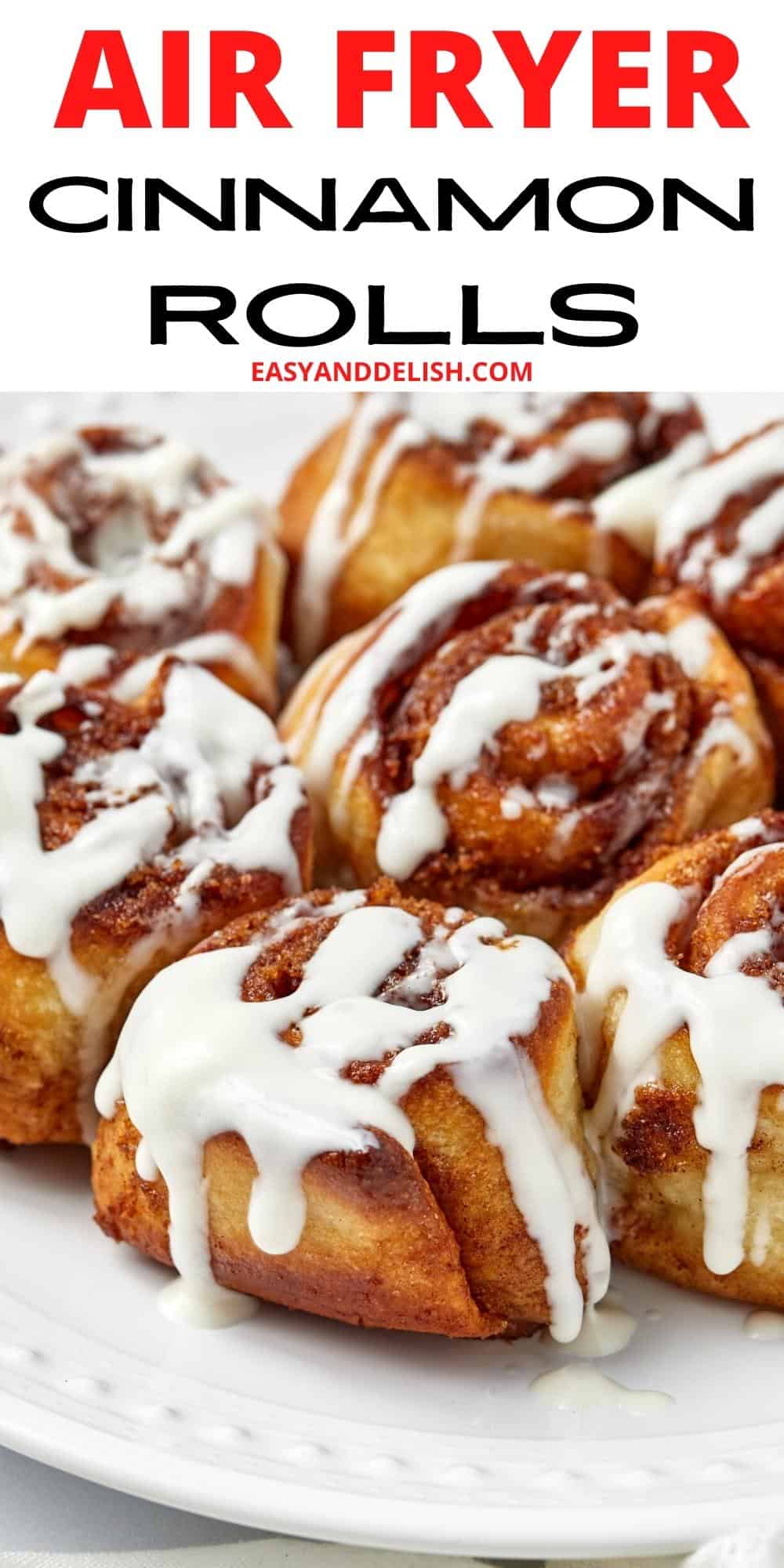 close up air fryer cinnamon rolls with cream cheese frosting.