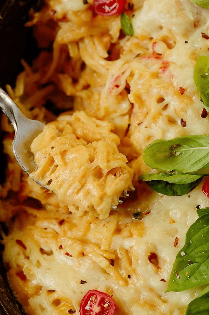 Close up of pasta bake rolled in a fork