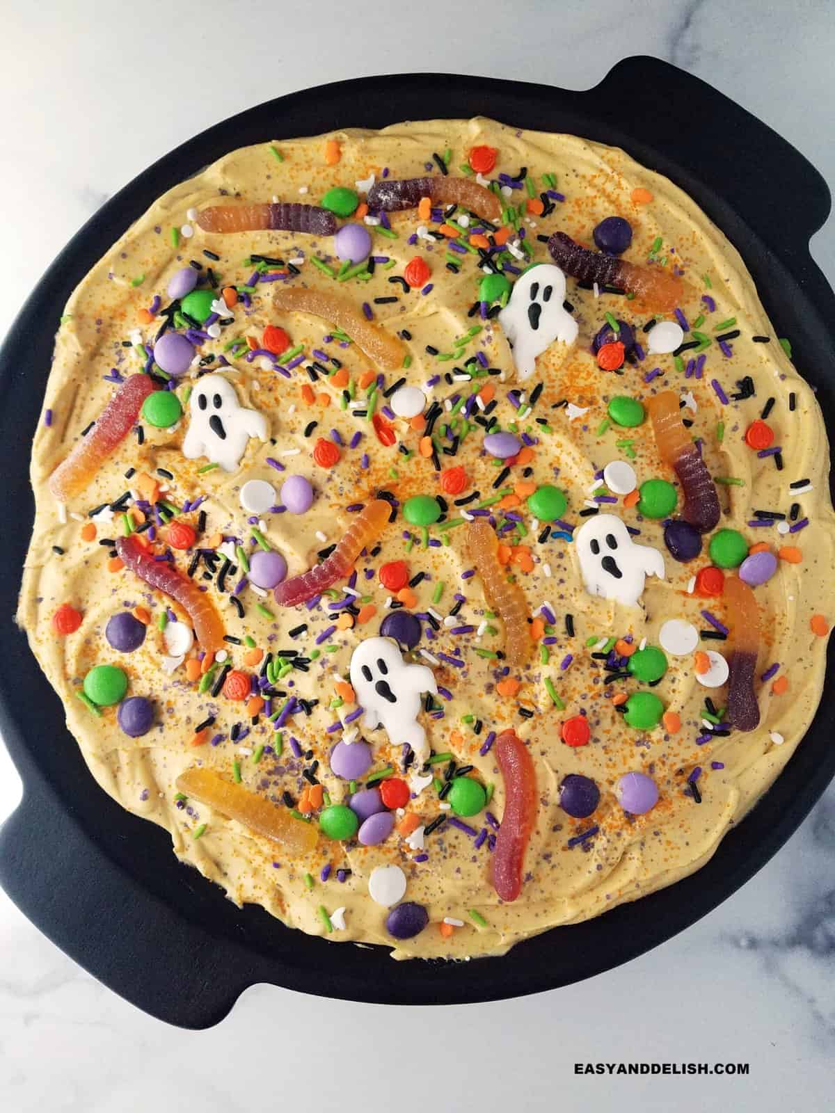 A large plate with a Halloween sweet spread