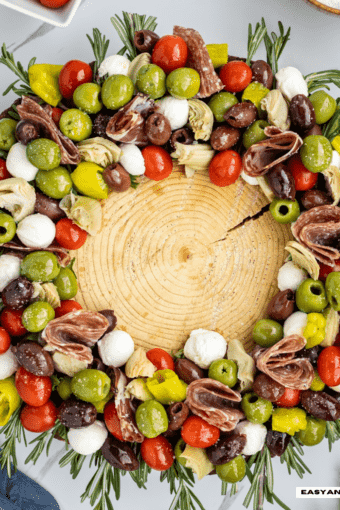 close up of antipasto salad arranged as a Christmas wreath.