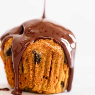 melted chocolate drizzled over a gluten-free pumpkin muffin.