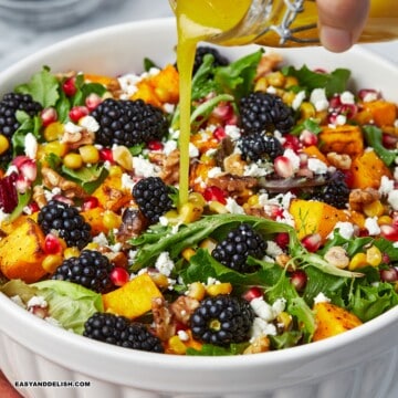 Roasted Butternut squash salad with kale drizzled with apple cider vinaigrette.o