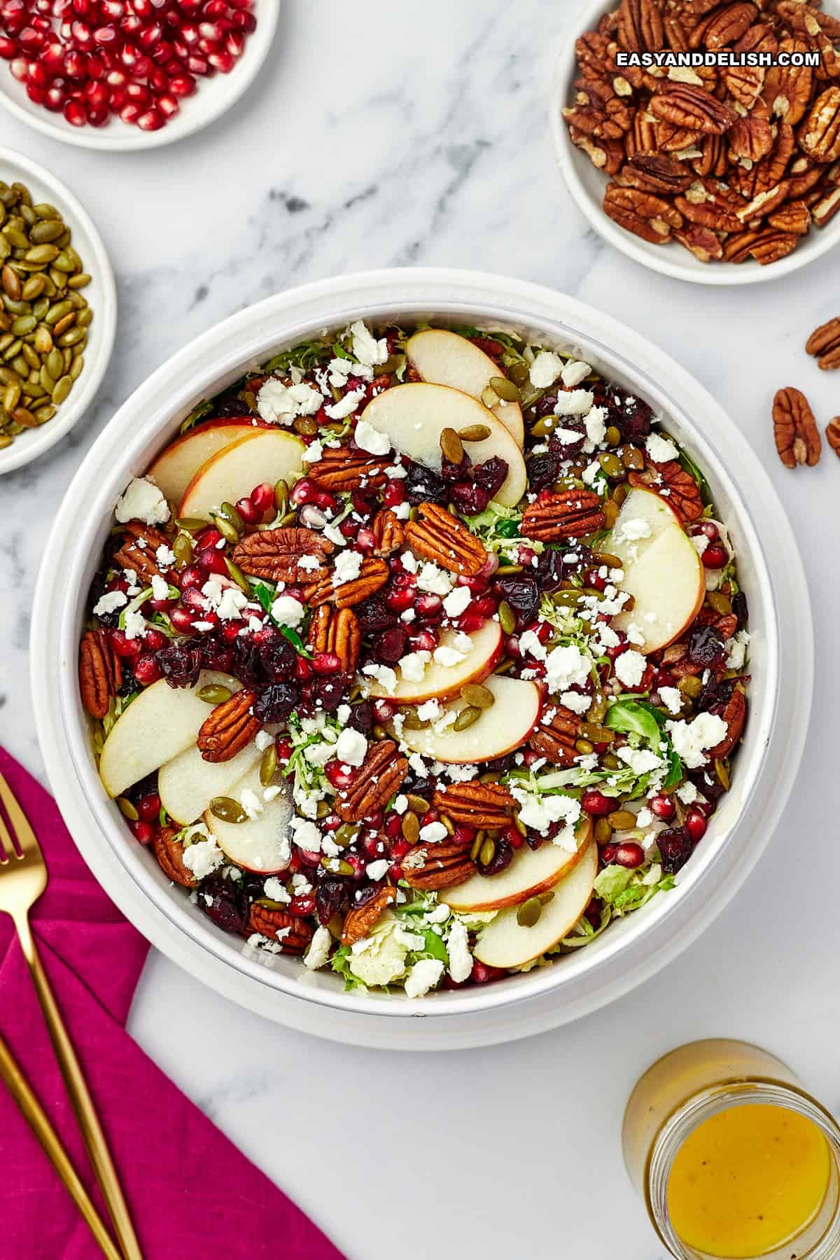 apple and brussels sprout salad with some ingredients around.