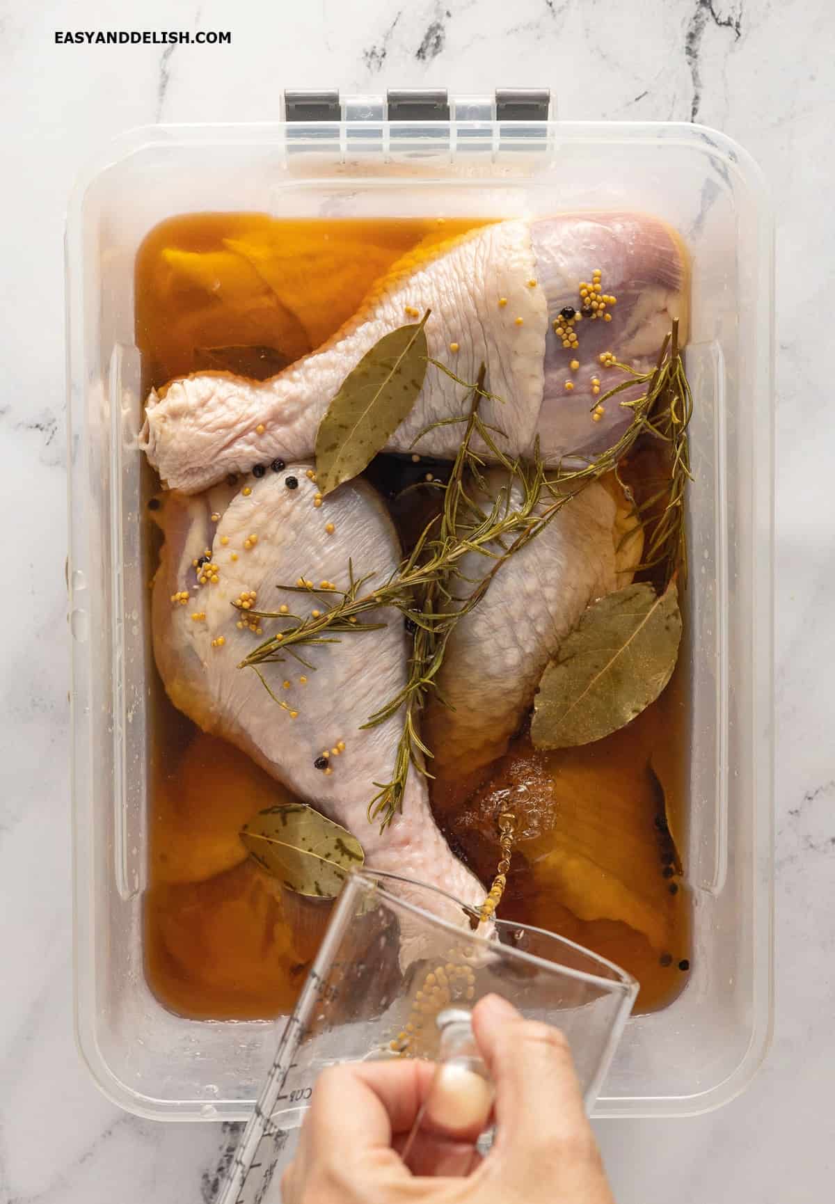 Drumsticks brining in a saltwater solution. 