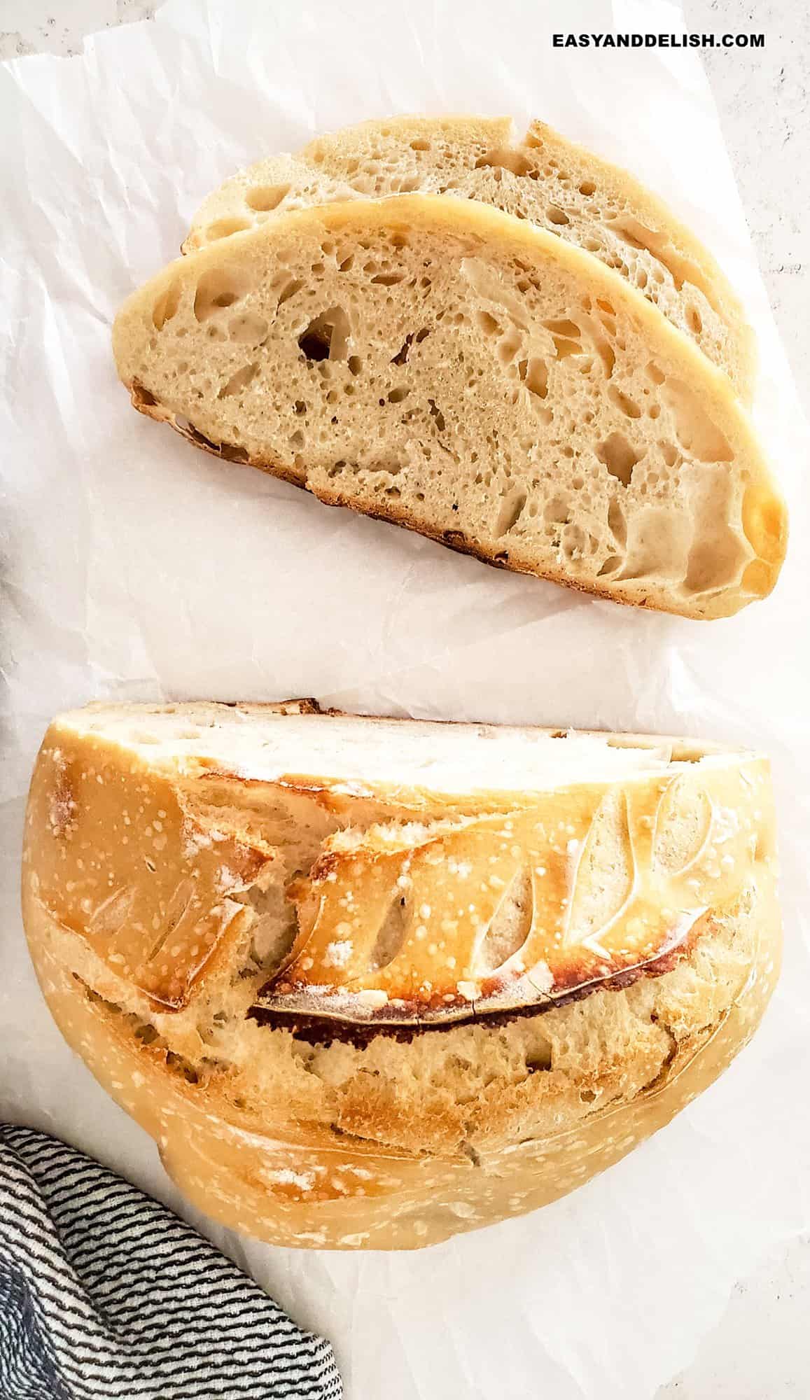 baked good partially sliced ona table with napkin on the side.