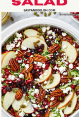 close up of a bowl of apple and shaved brussels sprout salad.