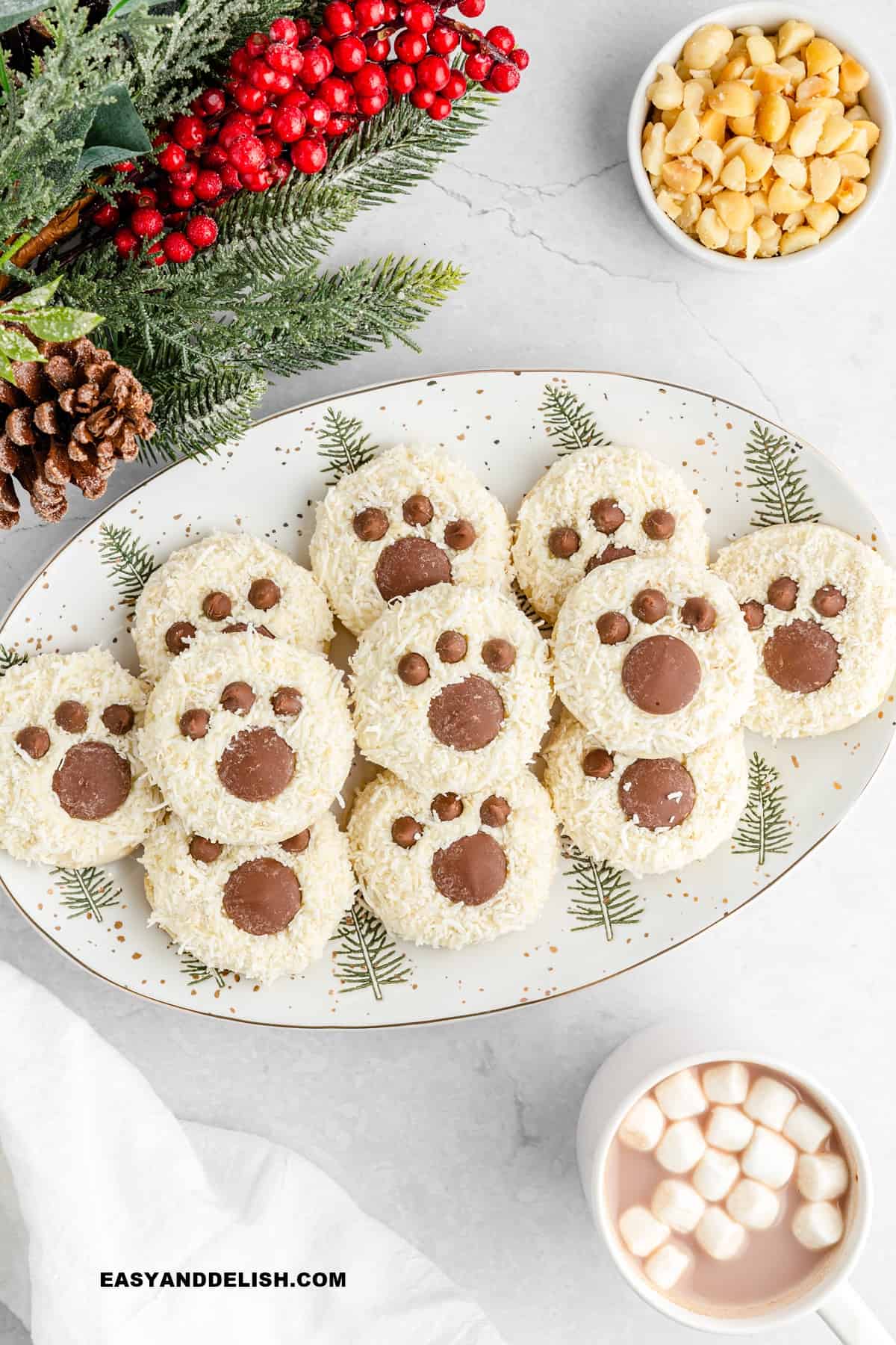 Christmas white cake mix cookies in a tray with holiday decorations around it.