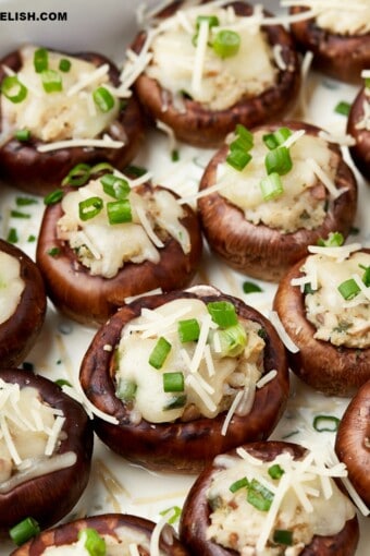 copycat Cheesecake Factory stuffed mushrooms garnished with chopped green onions on top.