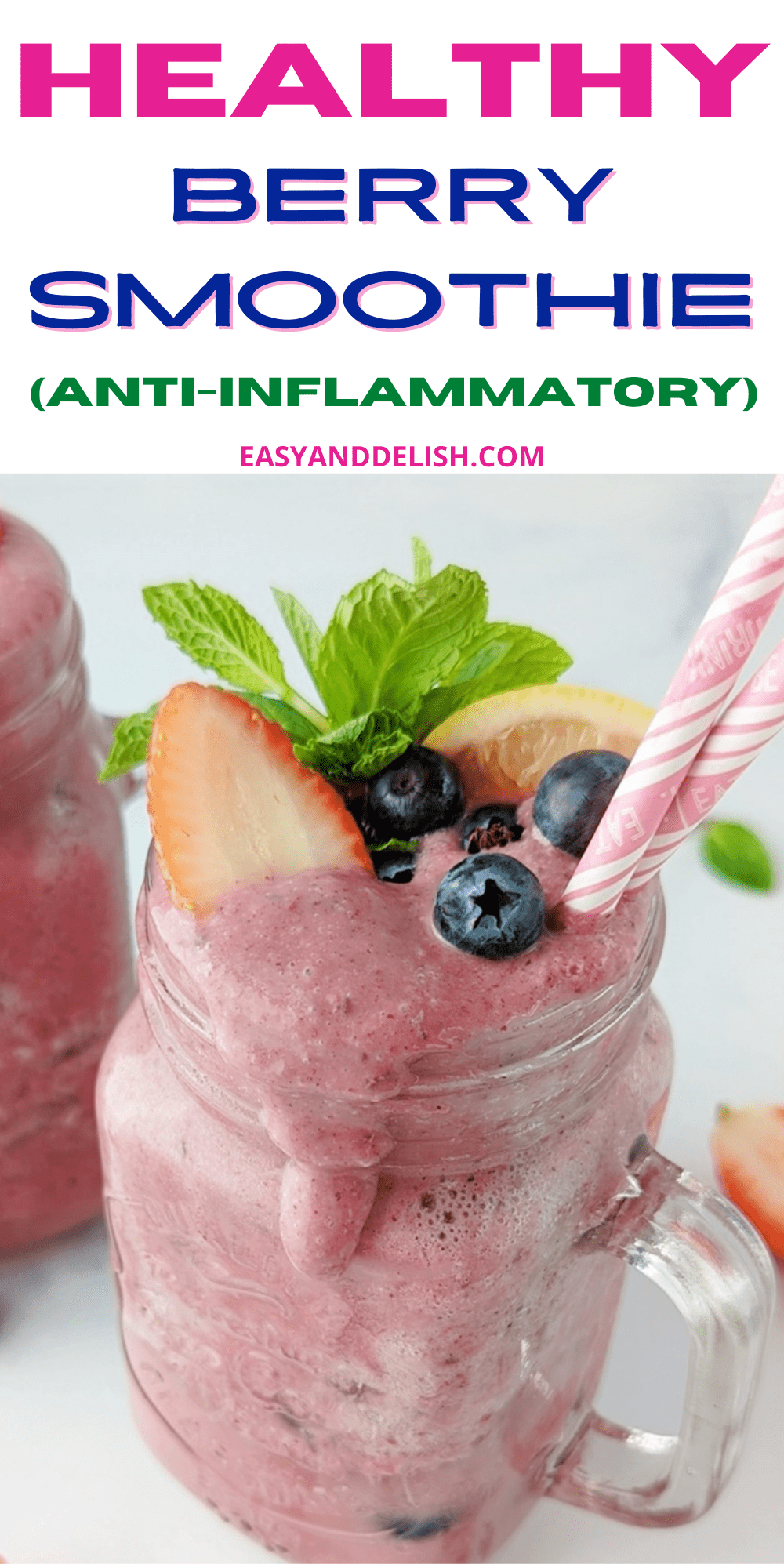 pin of anti-inflammatory berry smoothie garnished with mint, lemon,a nd mixed berries.