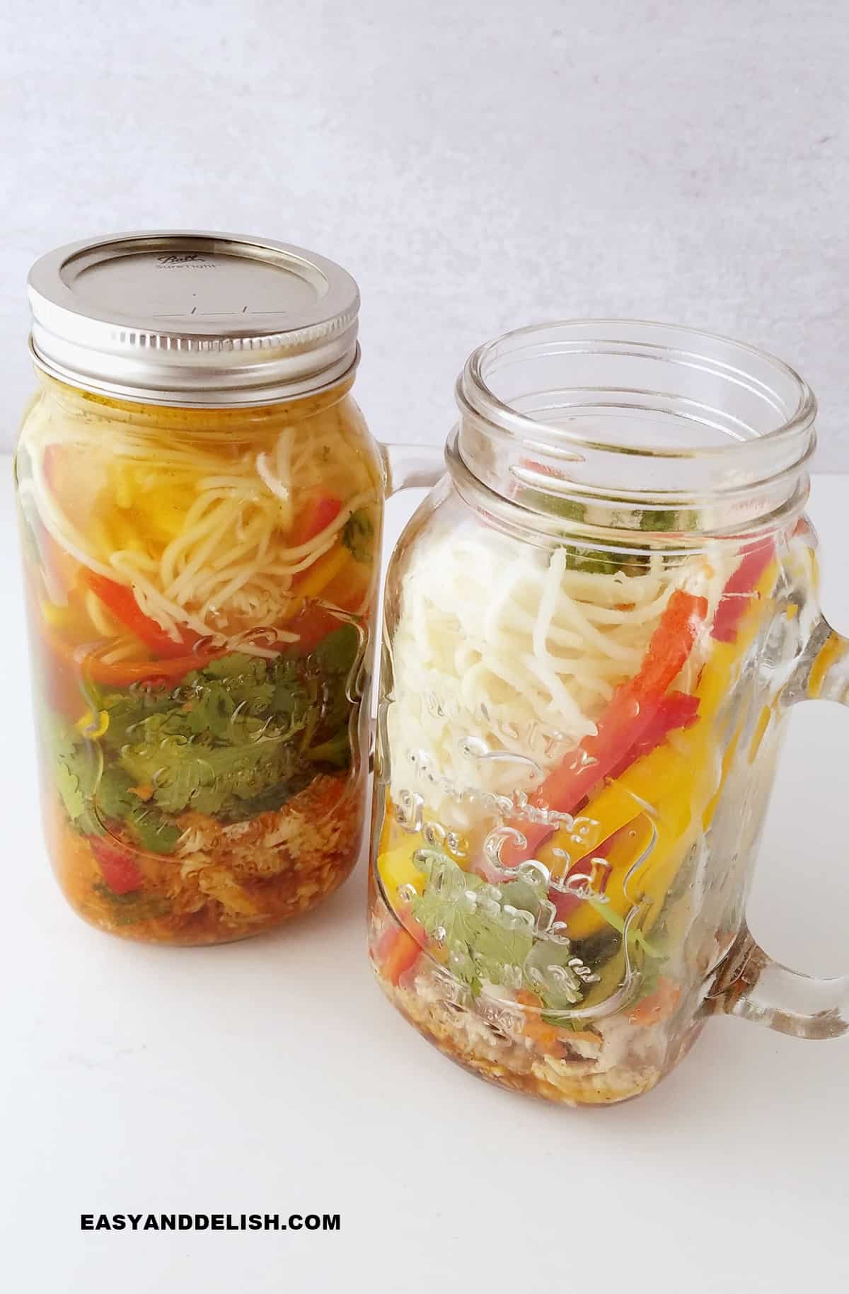 two jars of instant soup on a table.