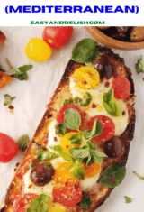 a close up of a bread pizza on a table with some of its ingredients around it.