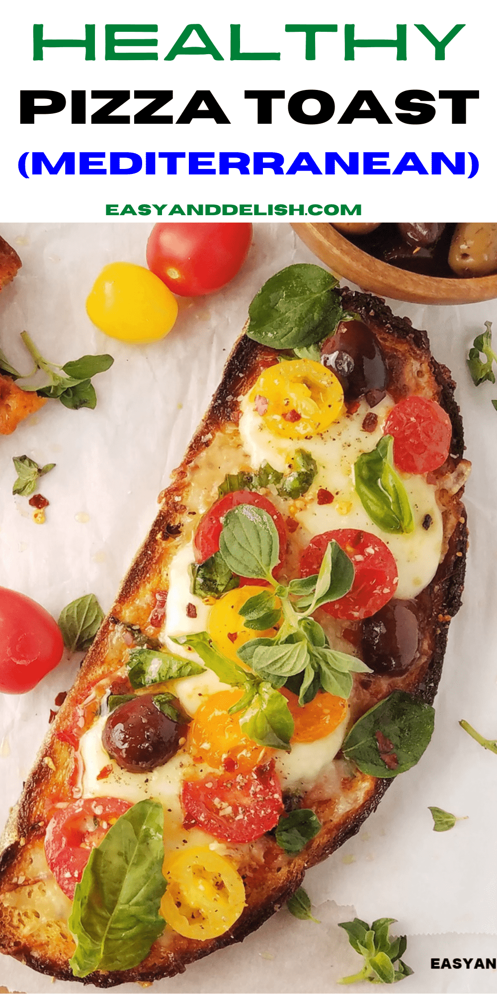 a close up of a bread pizza on a table with some of its ingredients around it. 