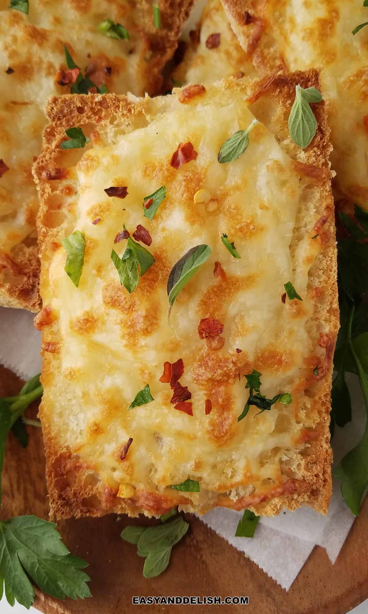 close up of a slice of air fryer garlic bread.