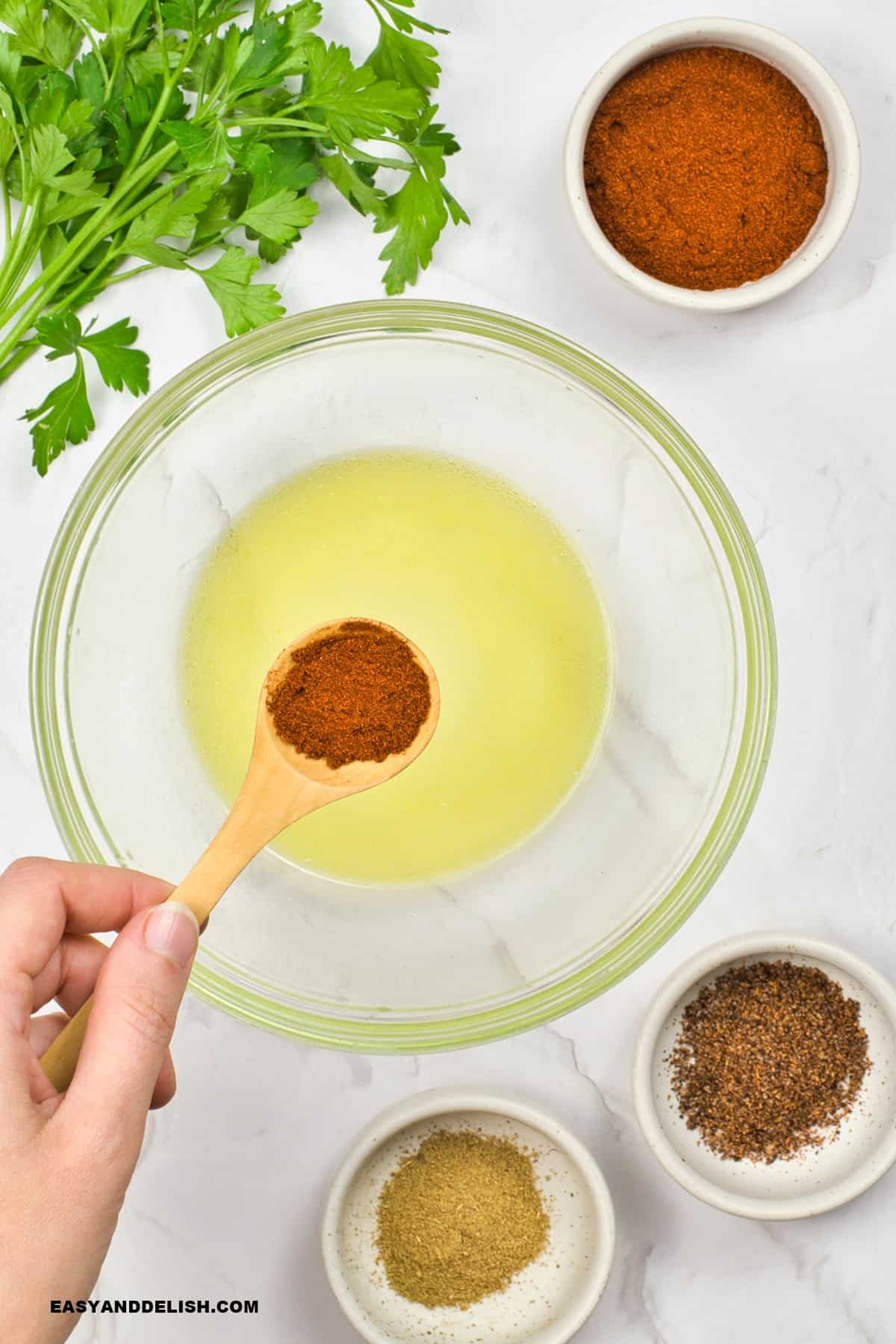 marinade ingredients being added to a  bowl.