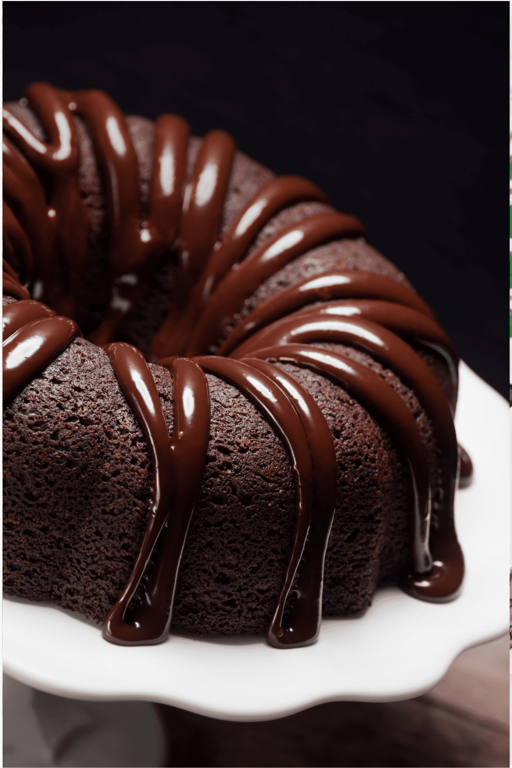 Pouring chocolate ganache over the cool bundt cake.