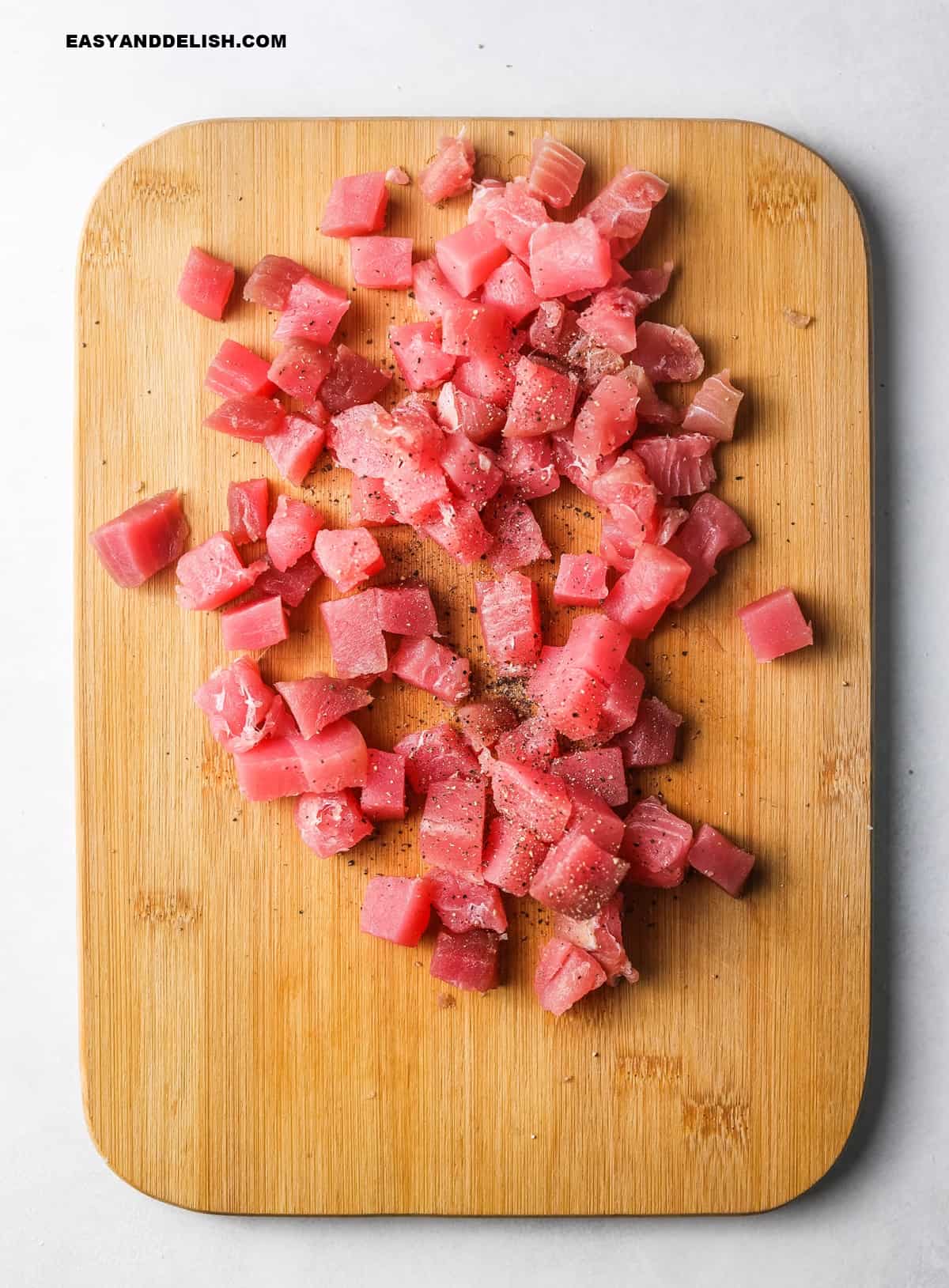 tuna pieces on a  cutting board.