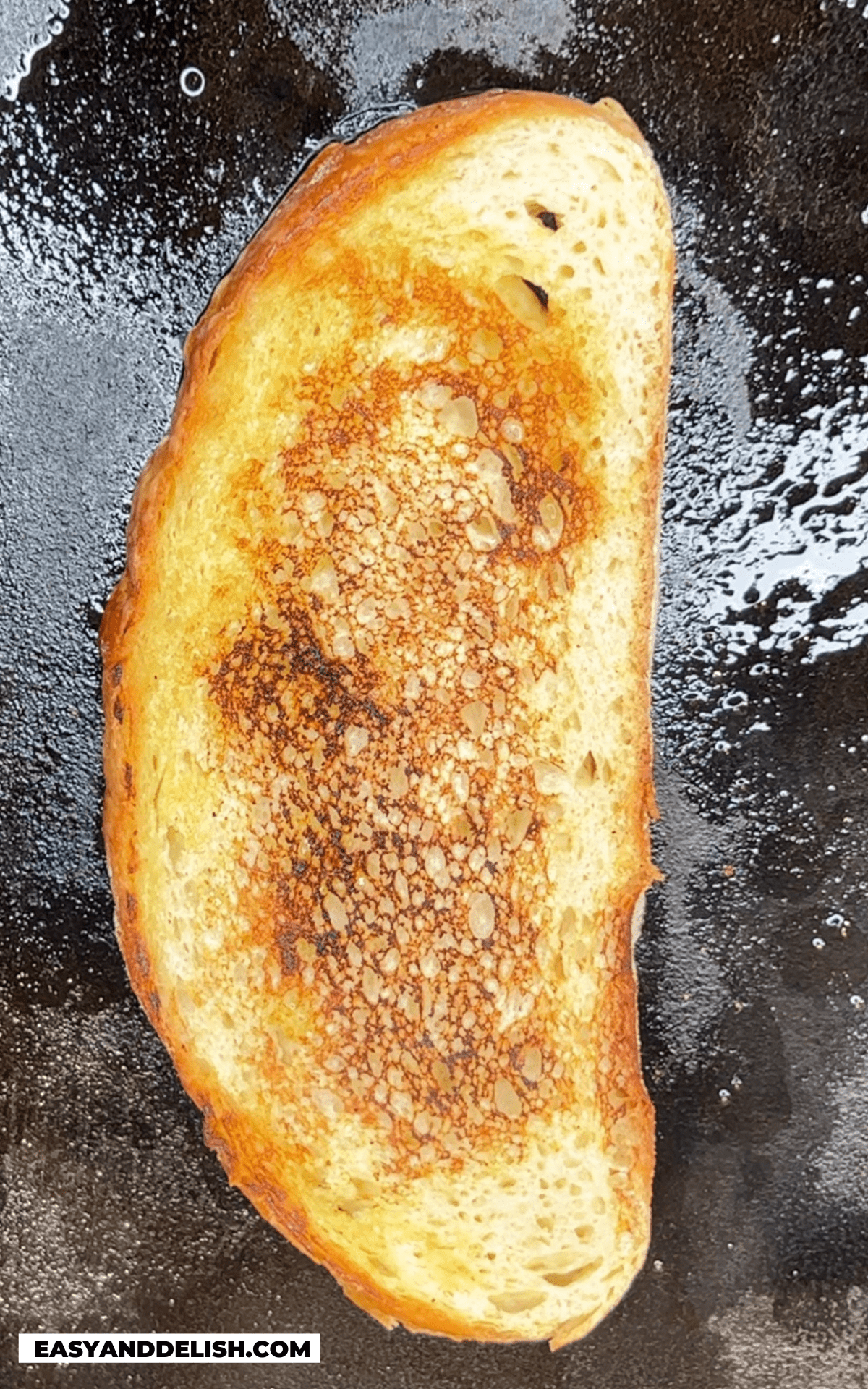 sourdough bread slice toasted on a  griddle.