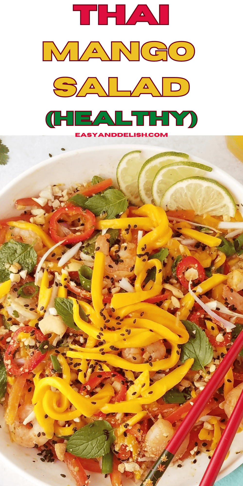 A bowl full of thai mango salad garnished with sesame seeds and lime.