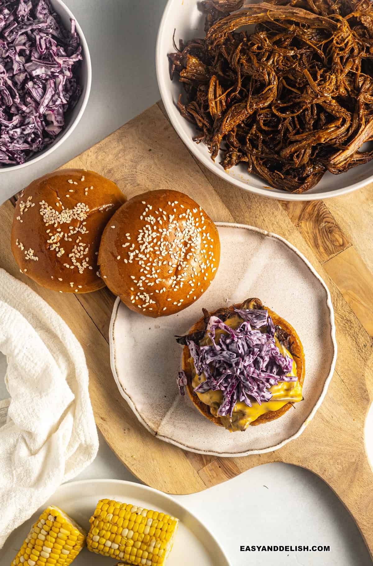 bbq brisket sandwich topped with coleslaw.