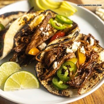 close up of brisket breakfast tacos in a plate.