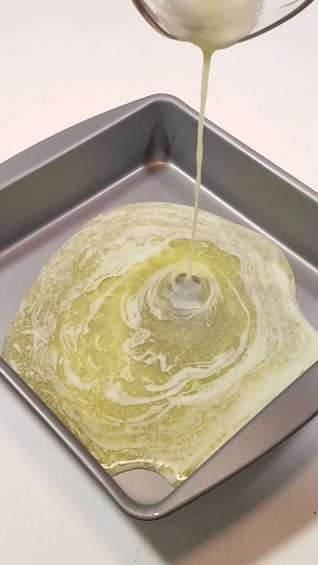 Melted butter in a  baking pan.