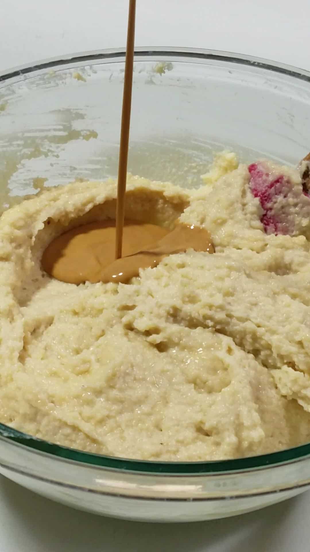 mixing dry and wet ingredients in a bowl.