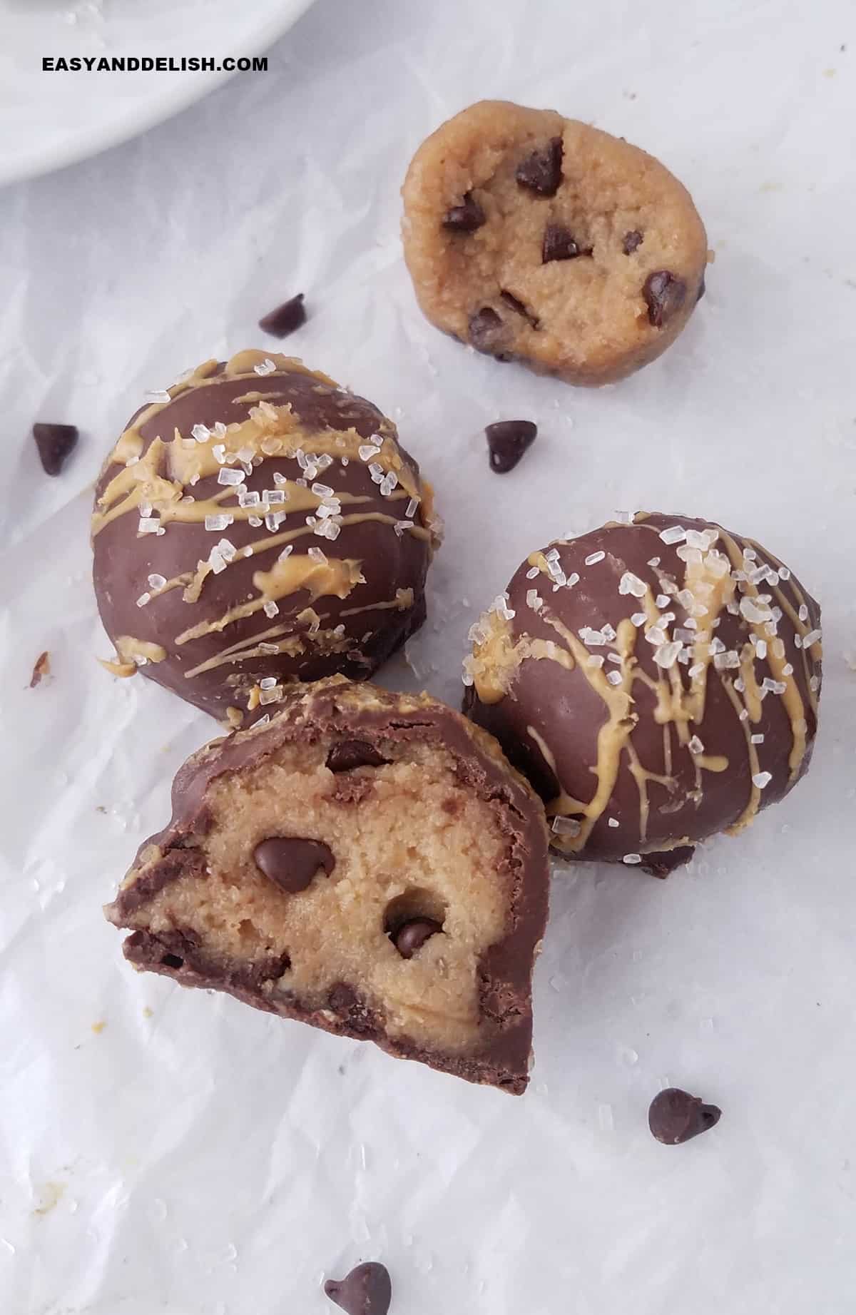 a few cookie dough protein bites on a table. 