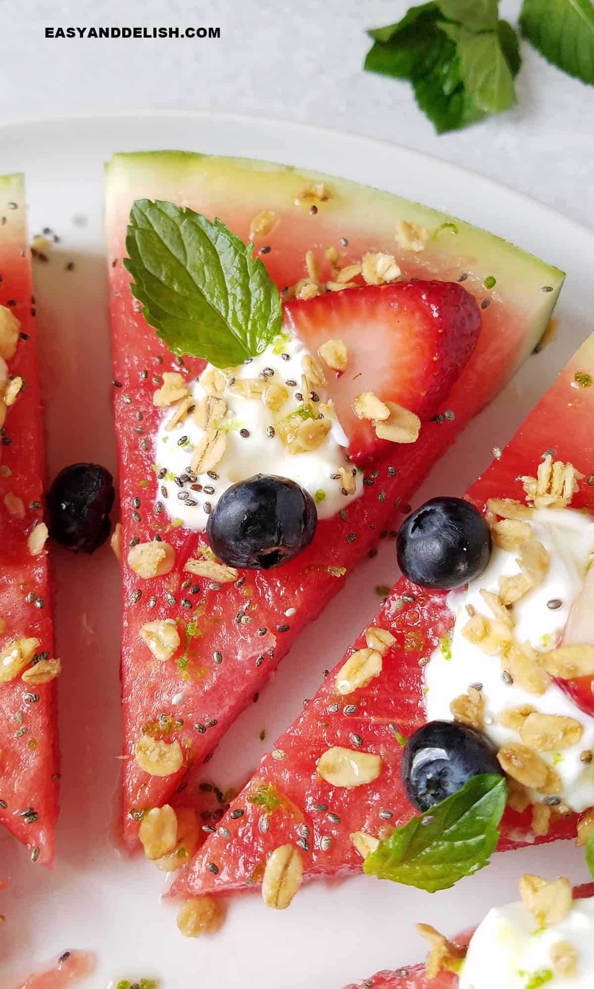 close up of a wedge fo watermelon pizza for breakfast.