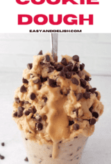 Pin of protein cookie dough in a glass with drizzle.