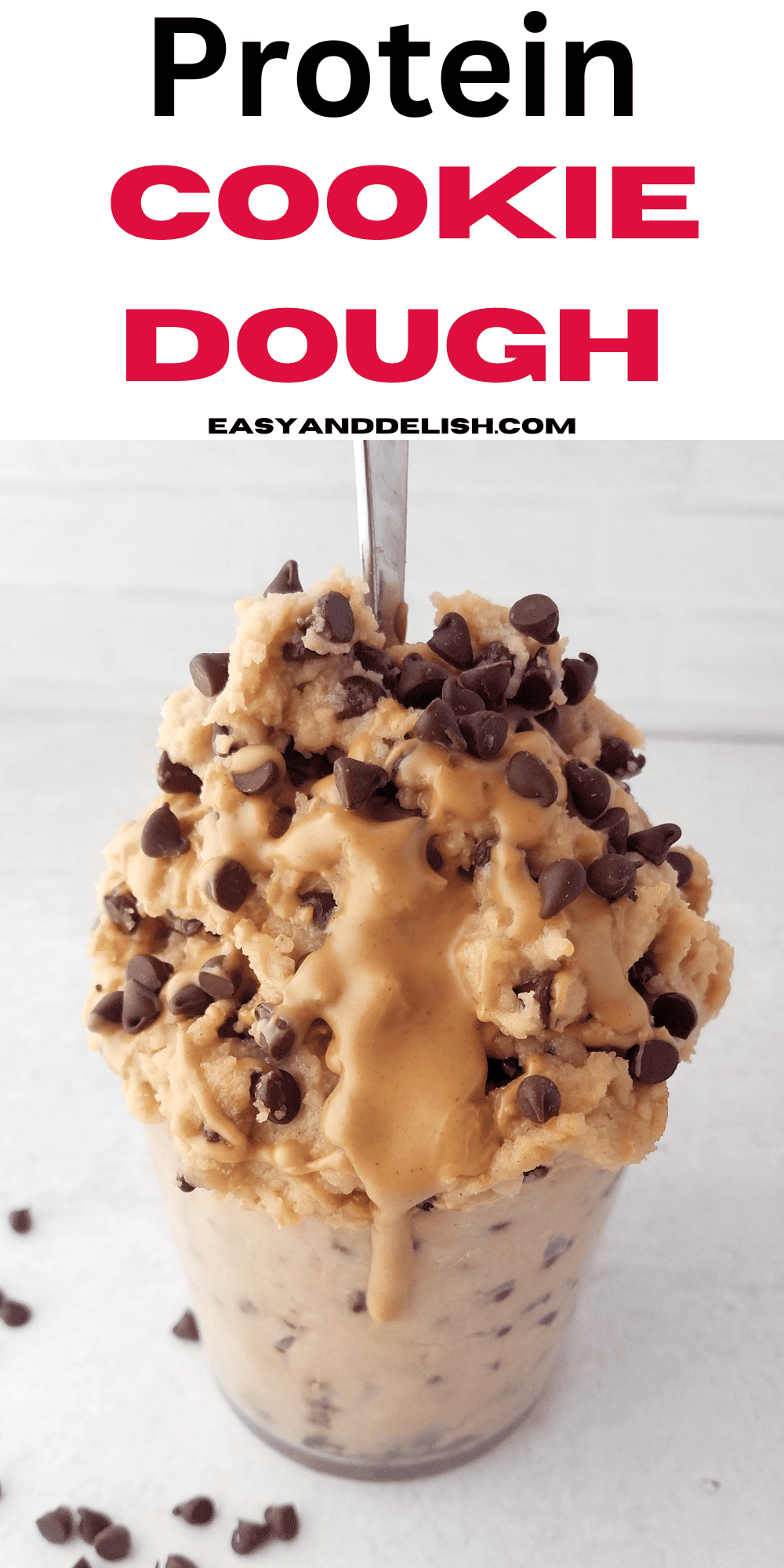 Pin of protein cookie dough in a glass with drizzle.