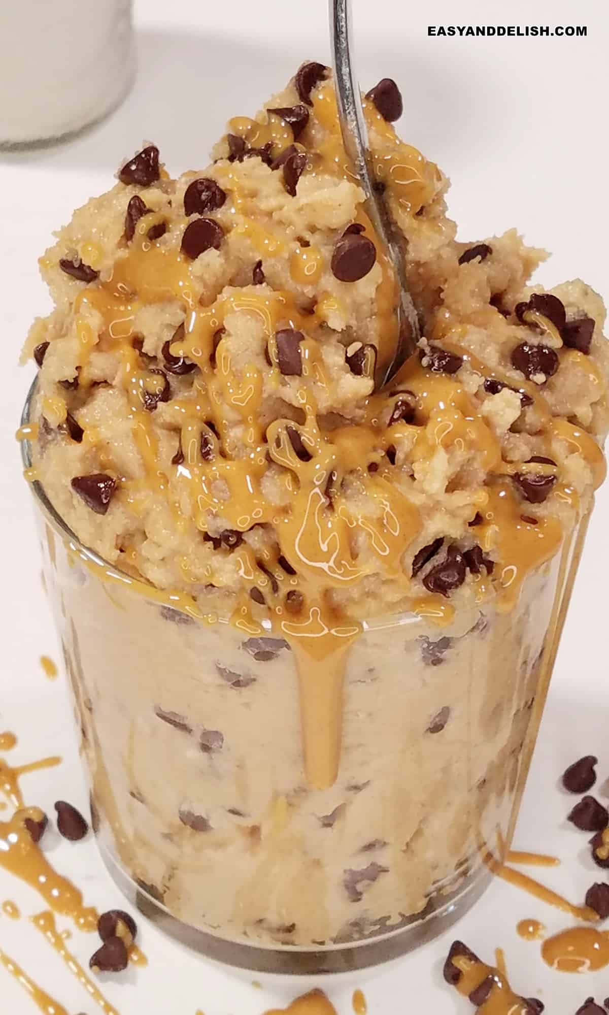 protein cookie dough with drizzle of creamy peanut butter.